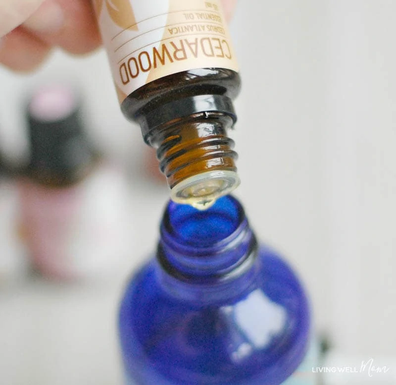 cedarwood essential oil drops added into diy sleep spray