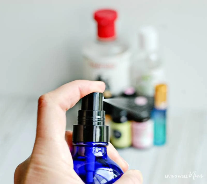 woman spraying a blend of calming oils for kids into the air