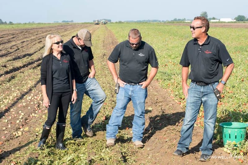 A group of people standing in a field