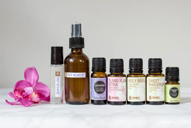 Lavender, ylang ylang, holy basil, sweet marjoram, and coriander seed essential oils to make DIY blend for moms. 