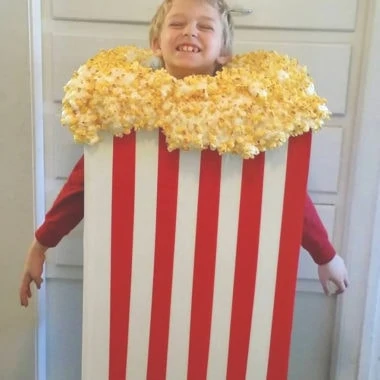 a kid wearing a popcorn Halloween costume