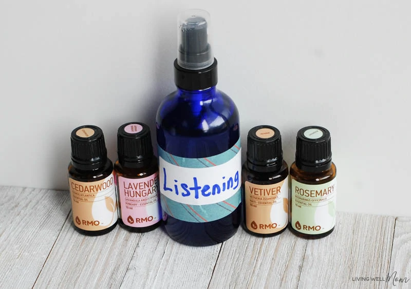 DIY listening essential oil blend and a spray bottle on a table