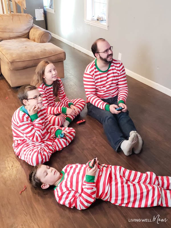 a Family playing a game in candy cane PJs