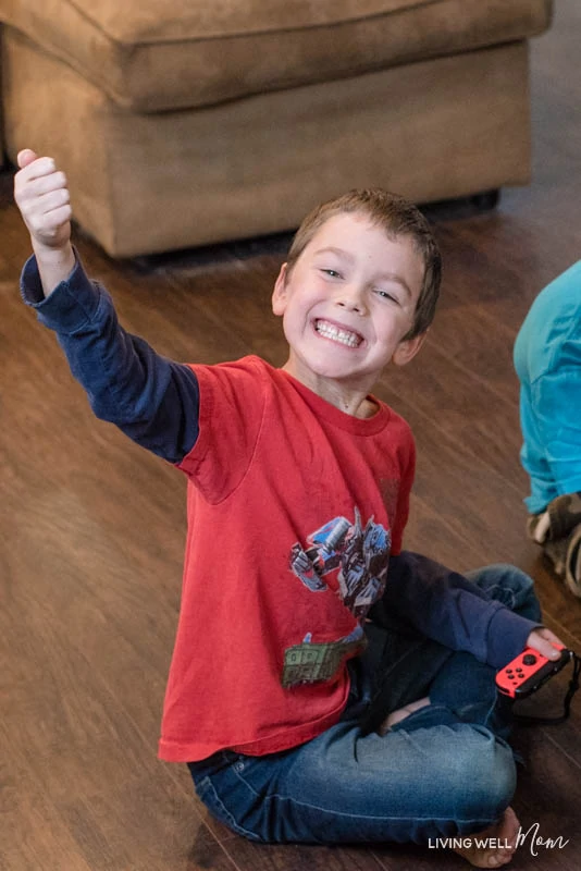 A little boy giving the thumbs up