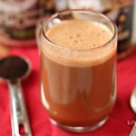 foaming homemade mocha latte with cocoa