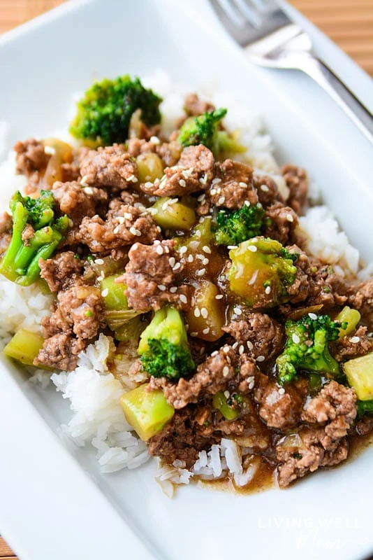 broccoli with ground beef and rice on a white plate
