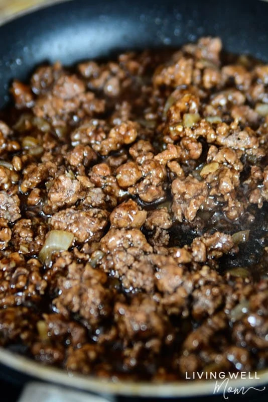 cooked ground beef in a pan with sauce