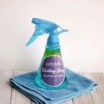 a homemade dusting spray on a blue towel