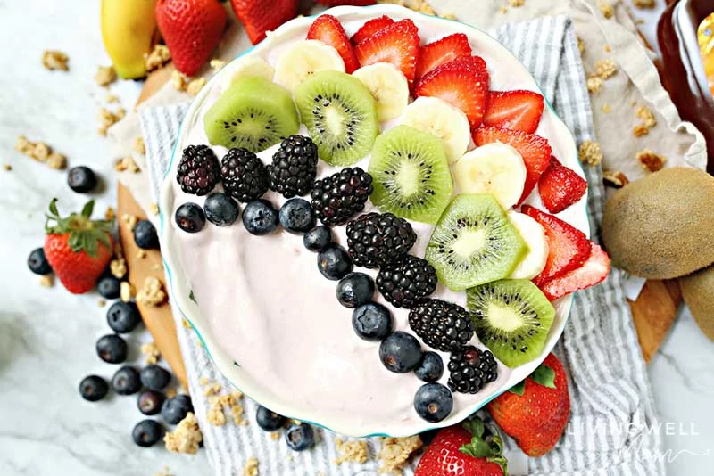 fruit and yogurt bowl with berries, kiwi, bananas, strawberries