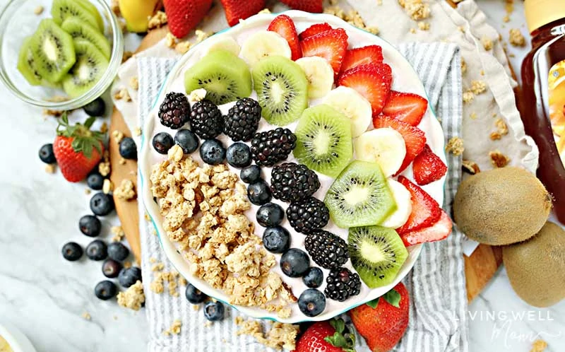 easy acai bowl recipe topped with fruit and granola