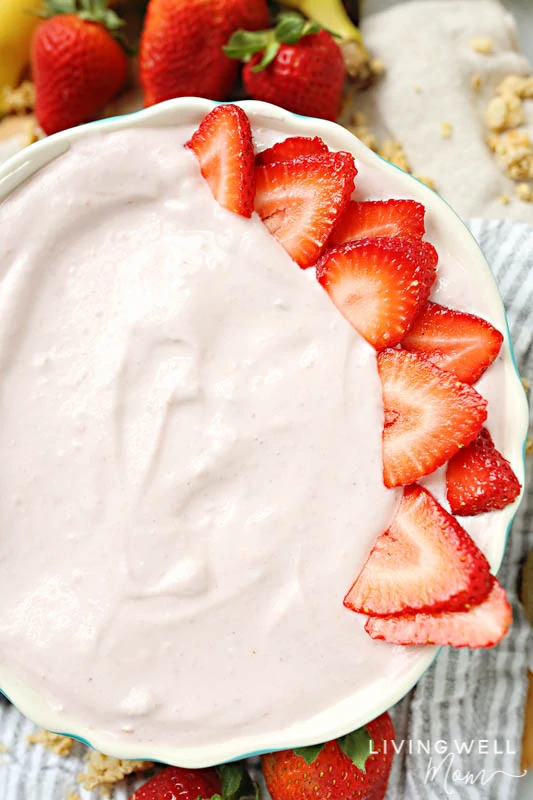 bowl of yogurt with slice strawberries
