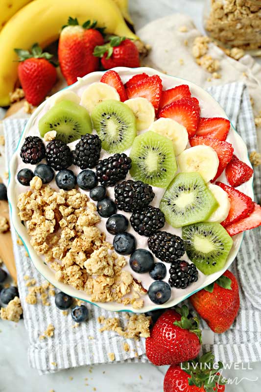 rainbow acai bowl with granola, fruit, and yogurt