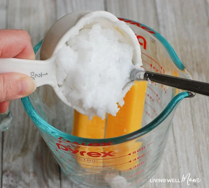 homemade insect repellent ingredients into a glass measuring cup