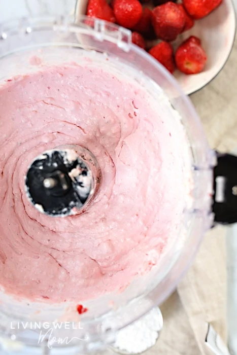 blending strawberry cheesecake fat bombs in a food processor