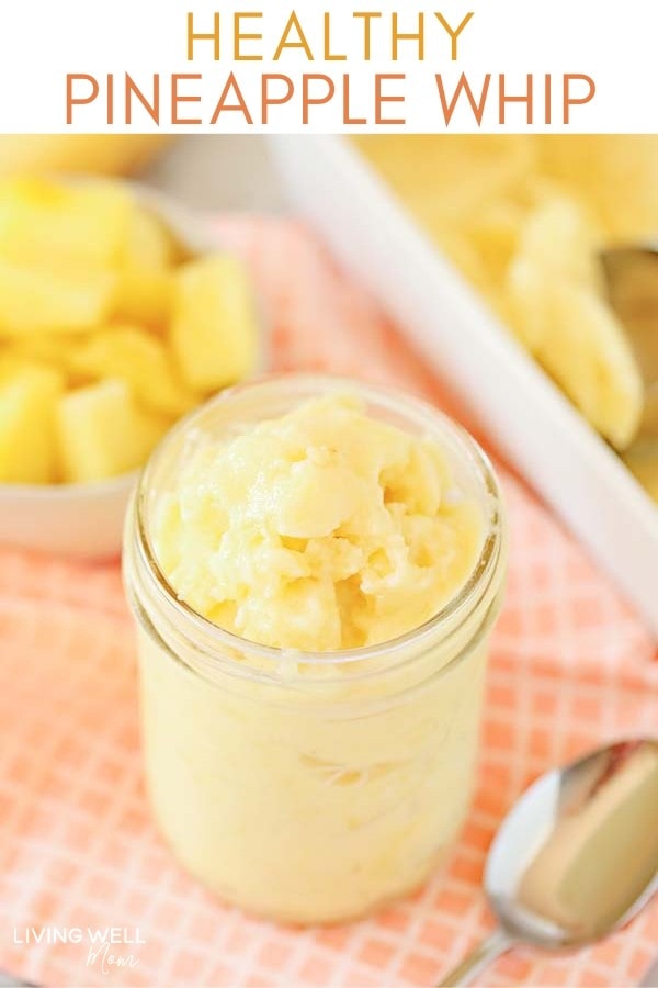 Healthy pineapple ice cream in a glass jar with a spoon. 