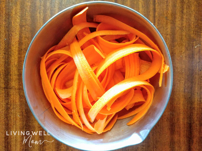 peeled spiralized carrots in a bowl