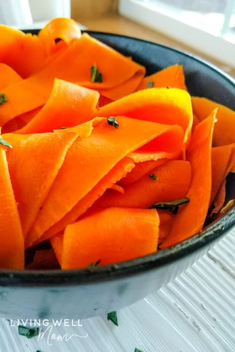 cooked spiralized carrots in a bowl