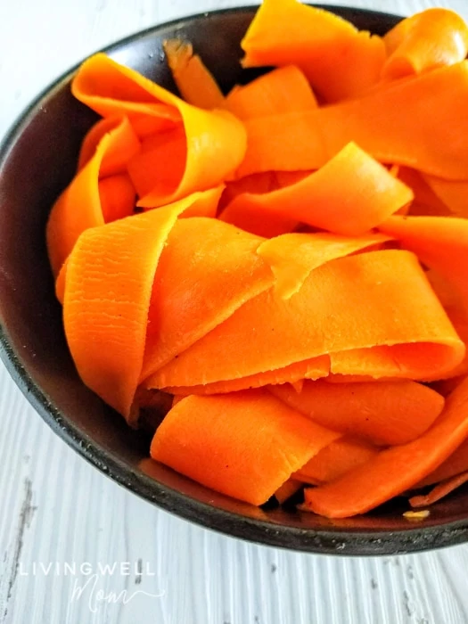 peeled carrot noodles in a bowl