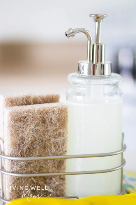 diy dish soap in a dispenser with a sponge