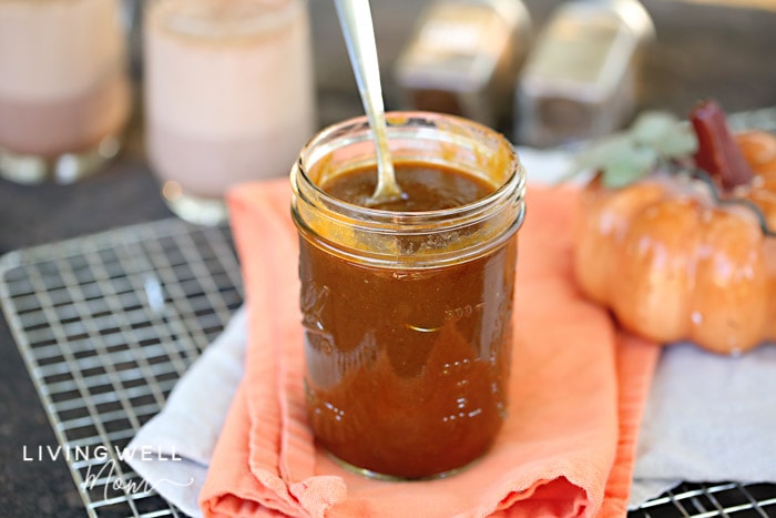 jar of pumpkin flavored syrup with a spoon