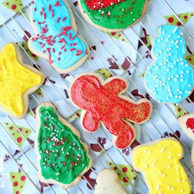 Christmas frosted gluten-free sugar cookies on a wire rack
