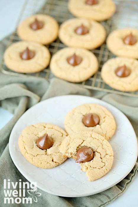 gluten-free peanut butter blossom cookies with hershey's kisses on a plate
