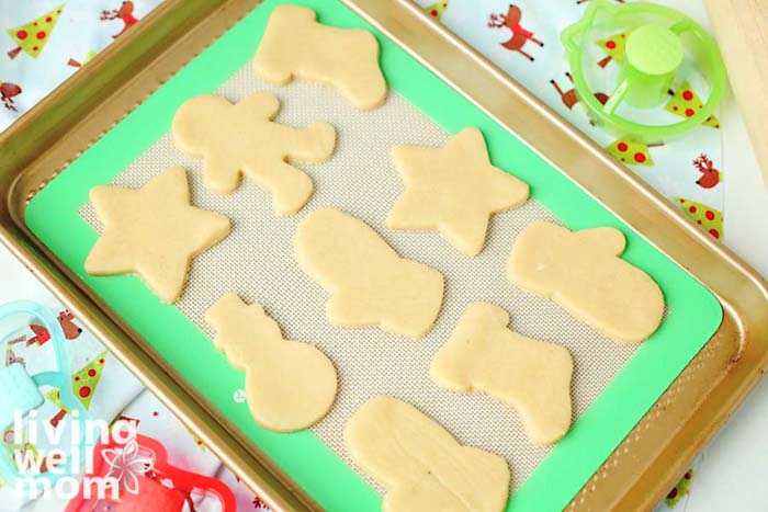 cookie cutouts on a lined baking sheet