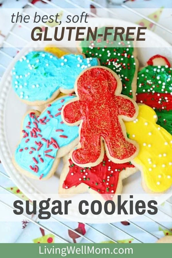 frosted gluten-free sugar cookies on a plate with Christmas sprinkles