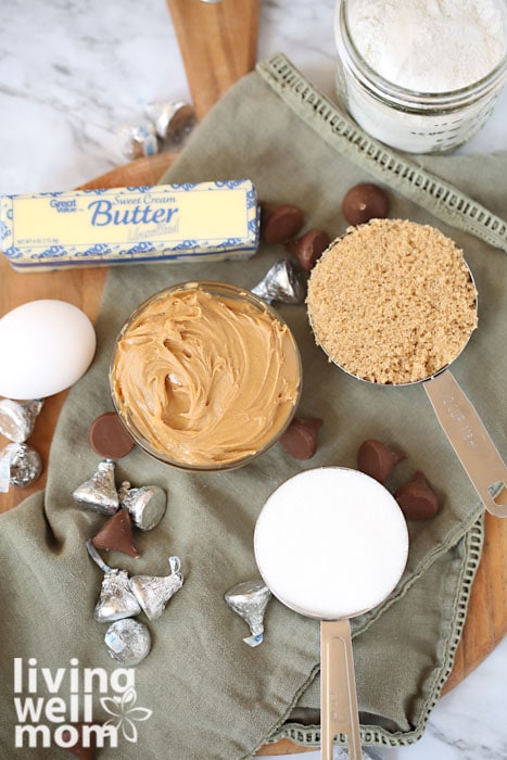 ingredients for peanut butter blossoms - peanut butter, butter, sugar, flour