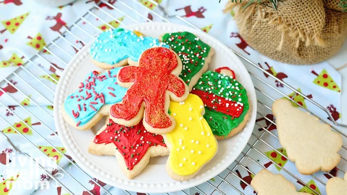 plate of frosted gluten-free sugar cookies with sprinkles