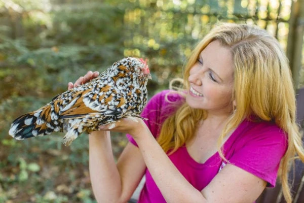 Erika Bragdon holding a chicken 