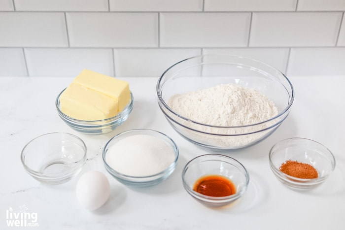 eggnog cookie ingredients in clear bowls