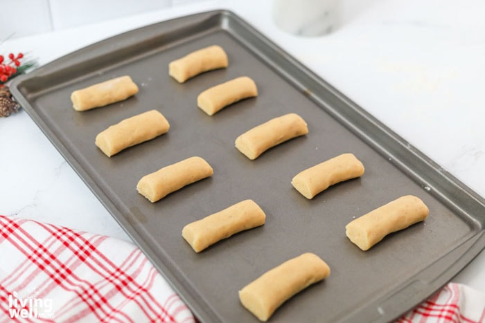 log-shaped cookies on a baking sheet