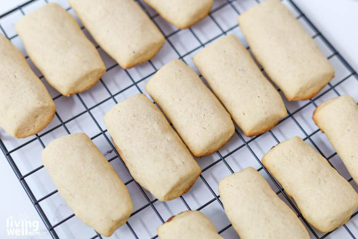 golden eggnog cookies on a cooling rack