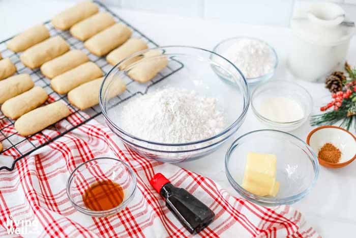 fresh baked cookie logs next to ingredients for frosting