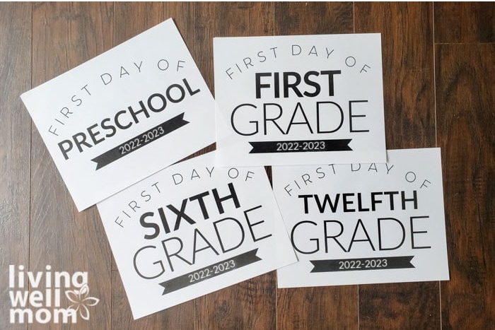 printed first day of school signs preschool-twelfth grade on dark wood