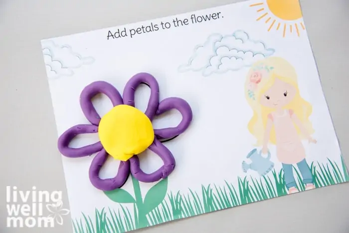 purple play-doh making petals of a flower