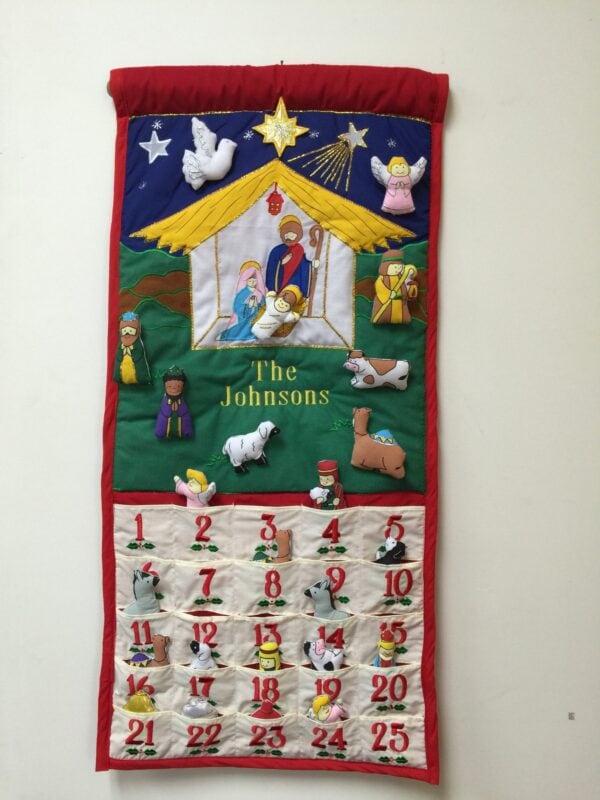 a cloth advent calendar with a nativity scene