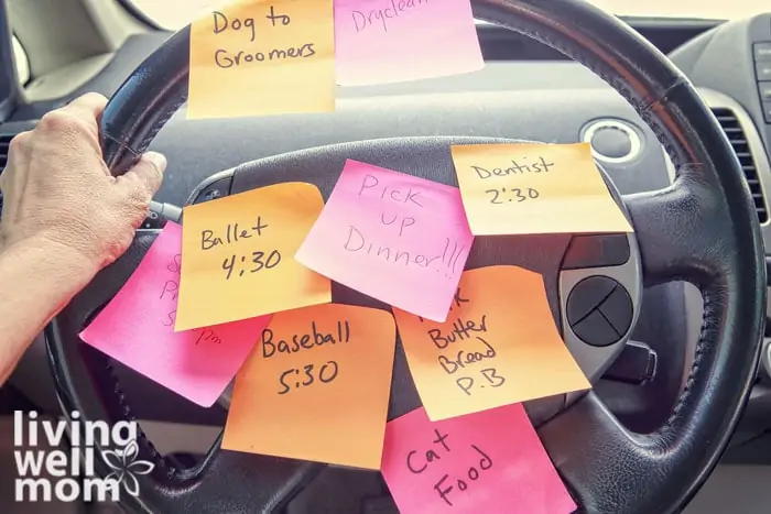 Steering wheel covered in notes as a reminder of errands to do