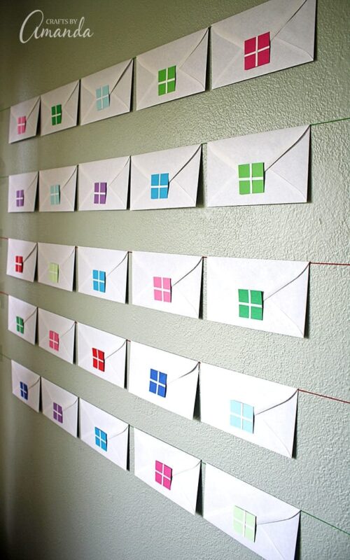 envelopes displayed along a wall for a Christmas countdown 