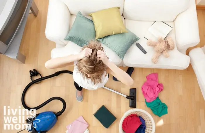 overwhelmed mom vacuuming The Living-room at home