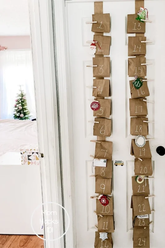 paper bags hanging on strips of burlap filled with prizes for each day of Advent