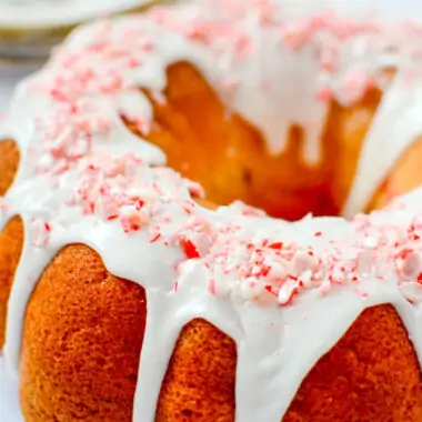 Candy cane bundt cake with crushed candy canes on top