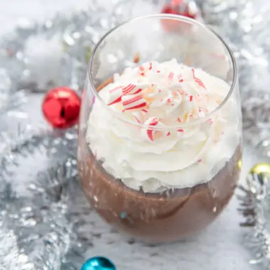 Glass filled with chocolate mocha pudding perfect for a Christmas dessert