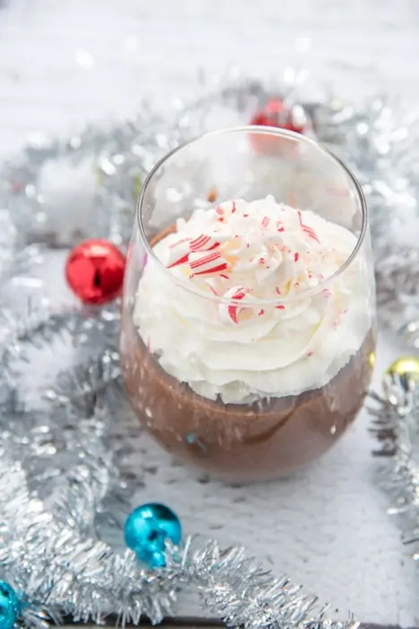 Glass filled with chocolate mocha pudding perfect for a Christmas dessert