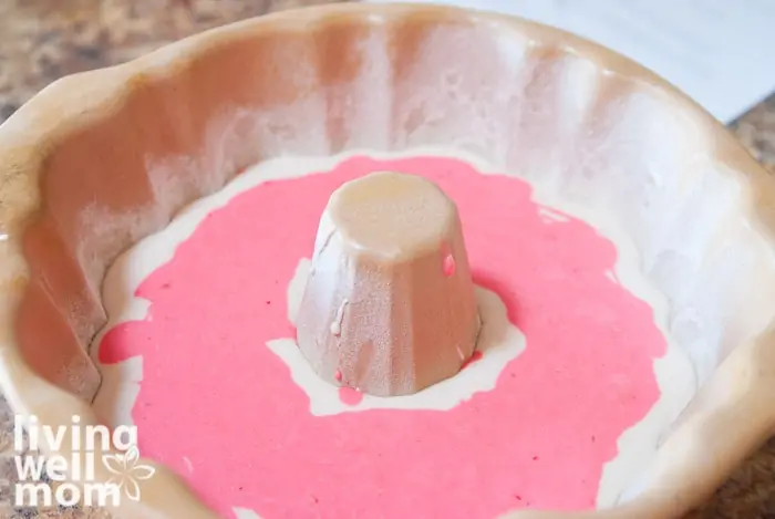 Layering a peppermint cake with white cake to create a christmas bundt cake