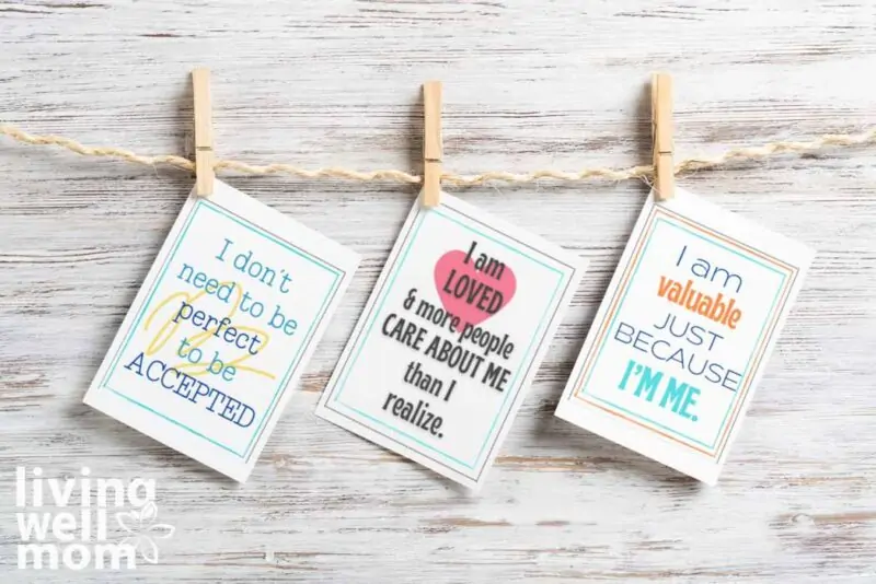 colorful cards with quotes for teens clothes pinned to a string