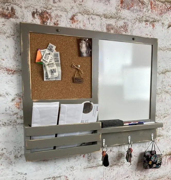 gray wall organizer with cork board and dry erase side for family command center ideas