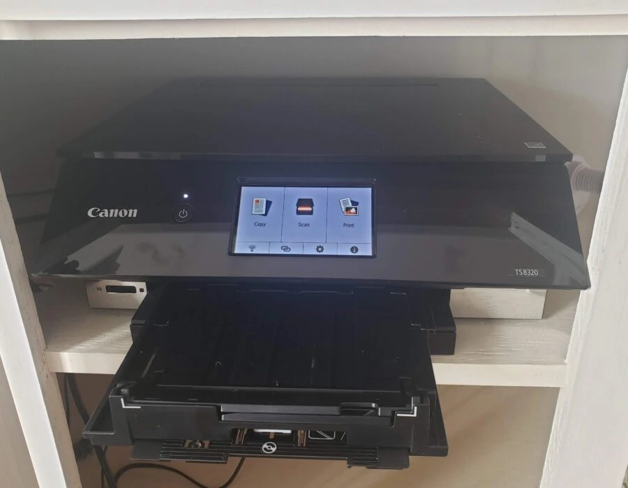 canon printer in cupboard