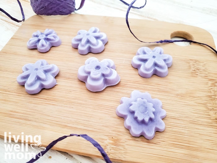 DIY butter bars displayed on a wooden cutting board, surrounded by swirls of purple twine.